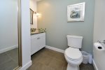 Half bath is off the living room and is spacious with beautiful touches.